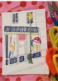 Carte à Broder "La Marchande de Parapluie"